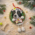 Load image into Gallery viewer, Dog Christmas ornament with customizable name and year, surrounded by festive decorations.