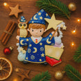 Load image into Gallery viewer, A cute blue-robed wizard boy Christmas ornament featuring a magic wand, star, open book and owl, perfect for kids. Personalized with name and year. Ideal holiday tree decoration for little wizard fans and magical Christmas gifts.