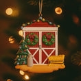 Load image into Gallery viewer, Decorative Christmas ornament of a red barn with wreaths, trees, and a milk jug on a tree.