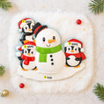 Load image into Gallery viewer, Personalizable snowman and penguin Christmas ornament on a snowy background with tree branches.