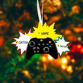 Load image into Gallery viewer, Personalized gamer controller Christmas ornament featuring a raised 3D front with detailed game controller design, including realistic buttons, joystick elements, and bold comic style accents. The ornament has a smooth flat 2D back for easy hanging and long lasting durability on the Christmas tree. The design allows personalization with a name and year clearly displayed on the front, making it a unique holiday keepsake. Bright colors and gaming themed details make this ornament perfect for kids, teens, and