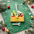 Load image into Gallery viewer, Personalized handyman ornament featuring a wooden style toolbox filled with tools including hammer wrench pliers and level. Custom name and year displayed on the front. Mostly 2D design with raised 3D tool details on the surface. Perfect Christmas ornament for handyman contractors mechanics and skilled trade workers.