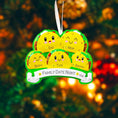 Load image into Gallery viewer, Decorative ornament shaped like a taco with cartoon faces on a Christmas tree.