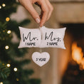 Load image into Gallery viewer, Personalized Mr and Mrs pillow ornament featuring a soft white cushion design with hanging heart detail. A romantic keepsake for newlyweds celebrating their first Christmas married or Valentine’s Day. Perfect wedding gift anniversary decor and couple ornament.