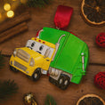 Load image into Gallery viewer, Cute personalized garbage truck ornament in green and yellow with animated truck face. Custom name and year option for kids who love trucks, garbage trucks, city vehicles and recycling themes. Perfect holiday tree decor for boys and toddlers obsessed with trucks. Bright colors, fun design, and adorable Christmas keepsake.