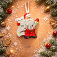 Load image into Gallery viewer, Decorative Christmas ornament of Santa Claus with a 'Nice List' sign on a festive background.