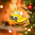 Load image into Gallery viewer, Yellow bulldozer ornament with face on a blurred Christmas tree background