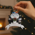 Load image into Gallery viewer, Personalized police car Christmas ornament featuring a black and white cop car design with BUSTED text, police lights and festive wreath detail. Customized with a name and year on the front banner. Glossy resin finish with bold black and white colors creates a fun and playful holiday look. Mostly 2D ornament with raised 3D details on the front only, lightweight and perfect for Christmas tree decor and police themed gifts.