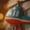 Load image into Gallery viewer, Close-up of a toy helicopter with a blurred background