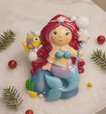 Load image into Gallery viewer, Personalized mermaid Christmas ornament with red curly hair, teal seashell top and purple tail, custom name and year holiday keepsake