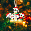 Load image into Gallery viewer, Christmas ornament with penguin family on a blurred Christmas tree background