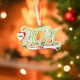 Load image into Gallery viewer, Decorative Christmas ornament with '2021' on a blurred Christmas tree background