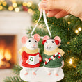 Load image into Gallery viewer, Two mouse ornaments in sweaters with a Christmas tree and fireplace in the background
