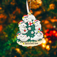 Load image into Gallery viewer, Decorative Christmas ornament with polar bears and customizable text on a blurred festive background.