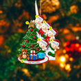 Load image into Gallery viewer, Personalized Christmas ornament with family of five around a Christmas tree, set against a blurred festive background.
