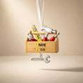 Load image into Gallery viewer, Personalized handyman ornament featuring a wooden style toolbox filled with tools including hammer wrench pliers and level. Custom name and year displayed on the front. Mostly 2D design with raised 3D tool details on the surface. Perfect Christmas ornament for handyman contractors mechanics and skilled trade workers.