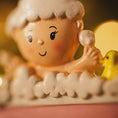 Load image into Gallery viewer, Toy figure of a child taking a bath with bubbles and a rubber duck.