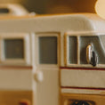 Load image into Gallery viewer, Close-up of a ceramic toy bus with a blurred background