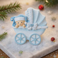 Load image into Gallery viewer, Personalized baby boy Christmas ornament featuring a light blue stroller with glitter details and a smiling baby wearing a blue nightcap. Custom name appears on the top and year on the bottom, making it a perfect Baby’s First Christmas keepsake. This blue resin holiday ornament is ideal for newborn boys, baby shower gifts, and celebrating a special first Christmas memory.