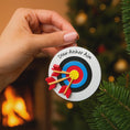 Load image into Gallery viewer, Personalized archery ornament featuring a colorful target and arrows design, customized with a name and year. Perfect for archery lovers, hunters, target shooting fans, and outdoor sports enthusiasts. This unique Christmas ornament celebrates precision, focus, and passion for archery, making it a meaningful holiday keepsake or gift for athletes, hobbyists, and competitive shooters.