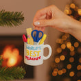 Load image into Gallery viewer, Personalized teacher ornament designed as a white mug filled with classroom tools including scissors ruler pencil and marker. The front reads Worlds Best Teacher with custom name personalization. Mostly 2D design with raised 3D tool details. A perfect Christmas ornament gift for teachers educators and school staff.