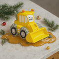 Load image into Gallery viewer, Yellow toy bulldozer with a face on a snowy surface with Christmas decorations.