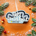 Load image into Gallery viewer, Personalized Big Brother Christmas ornament with custom name and year detail in layered blue and white design. This sibling holiday ornament features raised 3D front lettering and a lightweight flat back, perfect for Christmas tree decor.