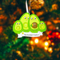 Load image into Gallery viewer, Avocado-shaped ornament with faces and text on a Christmas tree background
