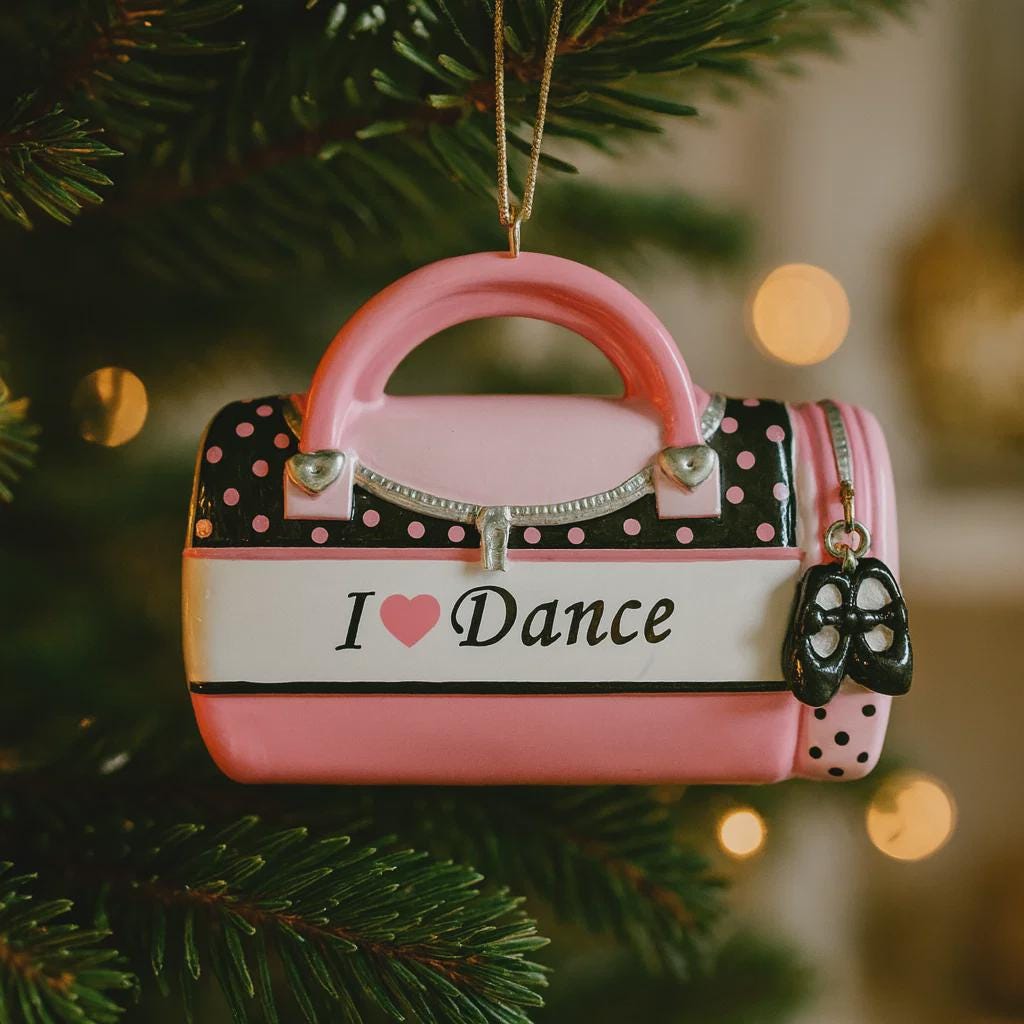 Pink polka dot handbag ornament with 'I ❤️ Dance' text on a Christmas tree.
