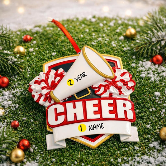 Decorative ornament with a megaphone and pom-poms on a grassy background