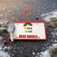 Load image into Gallery viewer, Decorative ornament resembling a 'New Driver' license plate with a key and holly decorations on a snowy background.
