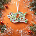 Load image into Gallery viewer, Decorative 'MOM' ornament with customizable text on a festive background.
