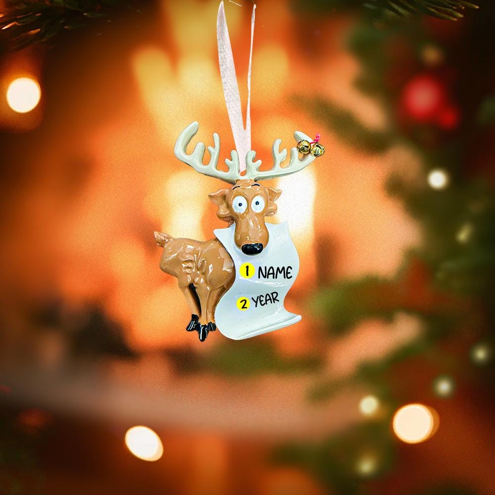 Decorative reindeer ornament with customizable text on a blurred Christmas tree background