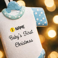 Load image into Gallery viewer, Personalized Baby’s First Christmas Ornament designed as a sweet baby bodysuit with soft blue polka dot sleeves and trim. This ornament features a raised 3D front with textured details and dimensional edges for a charming keepsake look. The baby’s name is added at the top and the year below, creating a meaningful newborn memory gift. Perfect for baby boy first Christmas, newborn celebration, holiday tree decor, and special family milestone ornament.
