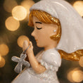 Load image into Gallery viewer, Decorative angel figurine with a cross pendant against a blurred light background
