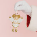 Load image into Gallery viewer, Decorative angel ornament held by a gloved hand against a pink background
