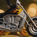 Load image into Gallery viewer, Metallic motorcycle model with flame design on a blurred background
