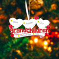 Load image into Gallery viewer, Decorative ornament with hearts and names against a festive background
