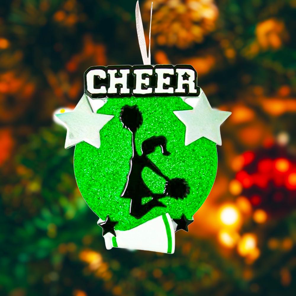 Personalized cheerleading Christmas ornament featuring a bright green glitter background with a cheer silhouette holding pom poms, bold CHEER title at the top, customizable name area on the lower banner, customizable year displayed on a star detail, and additional personalization space for school name or initials, glossy finish with raised 3D front elements and flat 2D back, white hanging ribbon, photographed on a snowy sports field themed holiday background with festive ornaments and winter greenery.