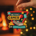 Load image into Gallery viewer, Personalized retro gamer Christmas ornament featuring a classic arcade style joystick and bold gaming icons. Raised 3D front details create depth while the back remains flat for easy hanging. Custom name and year placement make this ornament a fun and nostalgic keepsake for gamers and holiday tree decor.
