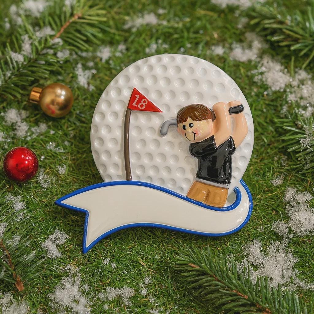 Golf-themed ornament with a golfer on a golf ball, surrounded by Christmas decorations.