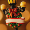Load image into Gallery viewer, Decorative Christmas ornament with a red bow and green wreath on a blurred background
