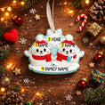 Load image into Gallery viewer, Personalized Christmas ornament with two seal and customizable text on a wooden background with festive decorations.
