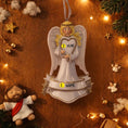 Load image into Gallery viewer, Decorative angel ornament with customizable text on a wooden background with Christmas decorations.
