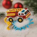 Load image into Gallery viewer, Toy fire truck with a blue gear on a snowy background
