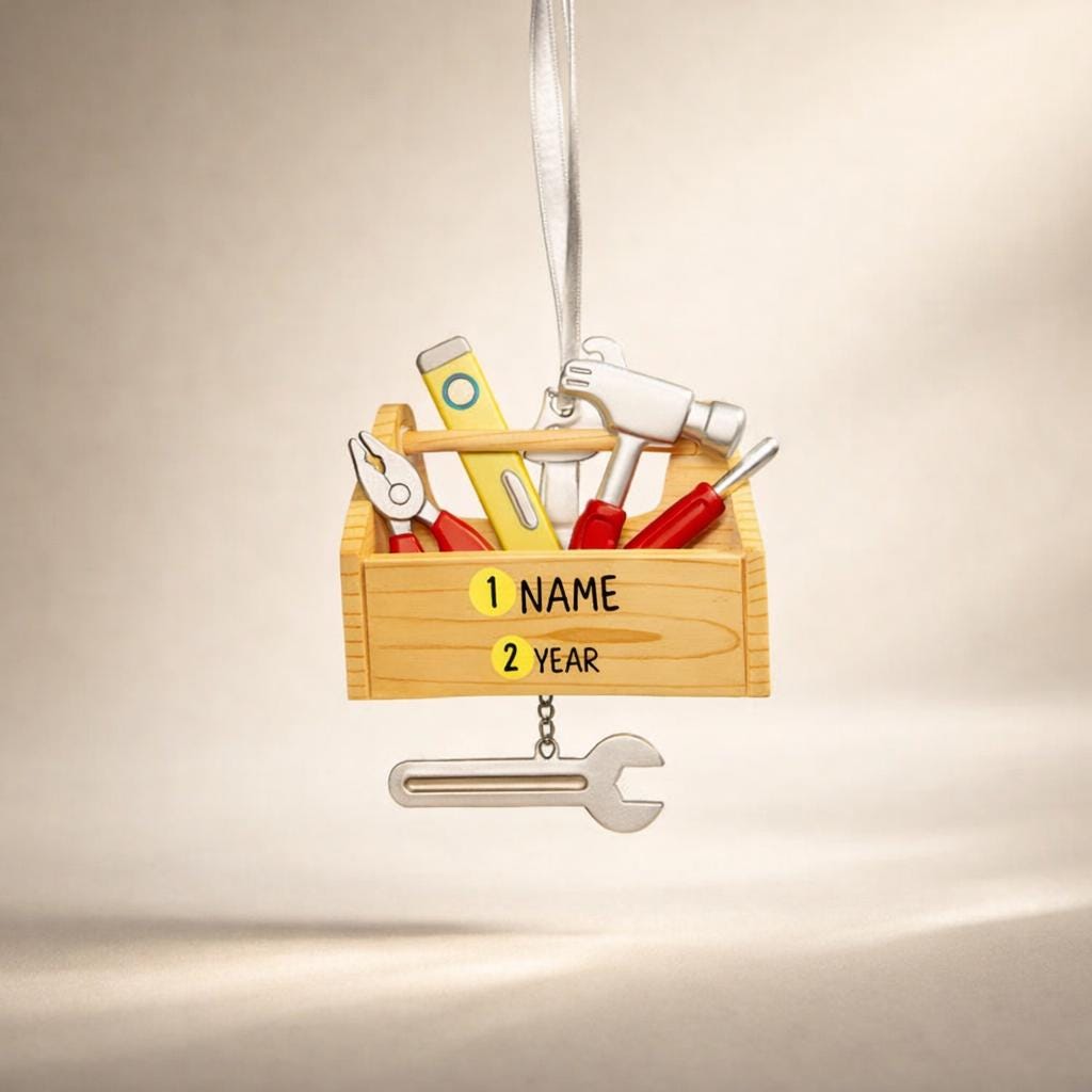 Personalized handyman ornament featuring a wooden style toolbox filled with tools including hammer wrench pliers and level. Custom name and year displayed on the front. Mostly 2D design with raised 3D tool details on the surface. Perfect Christmas ornament for handyman contractors mechanics and skilled trade workers.