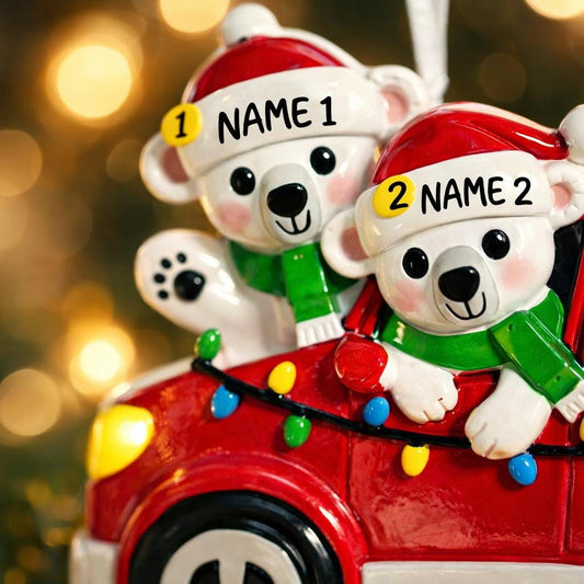 Personalized Christmas ornament featuring two polar bears wearing Santa hats riding in a red car decorated with colorful holiday lights. The ornament includes custom name personalization on each bear and a year displayed on the car. Designed with a detailed 3D raised front and smooth glossy finish, it is made for easy hanging on a Christmas tree. Perfect for festive holiday decor, couple ornaments, family keepsakes, and seasonal gift giving.