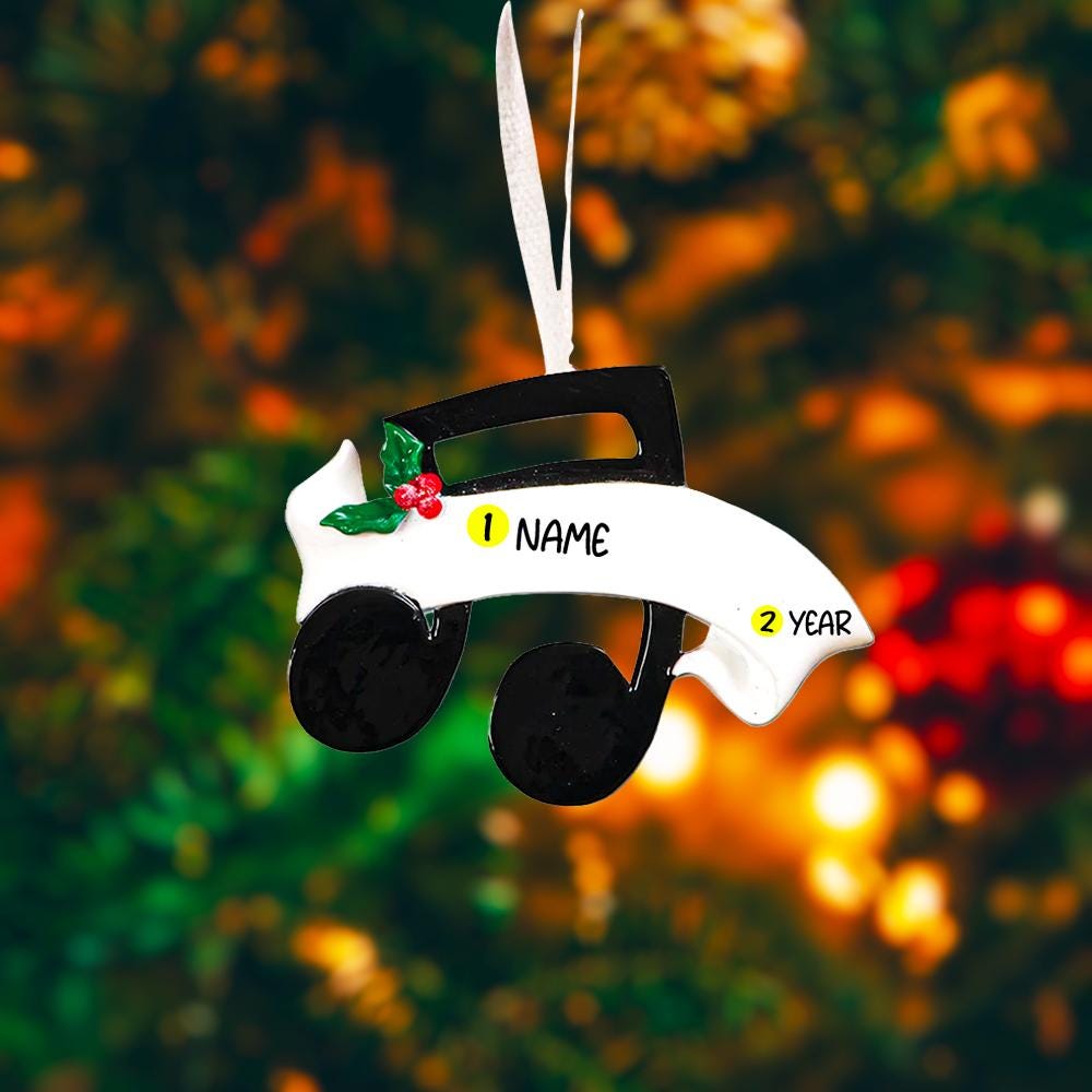 Personalized music note ornament featuring a classic black and white musical note design with subtle holiday accents. Customizable with one name and a year. Crafted from resin with detailed 3D raised front elements and a flat 2D back for balanced hanging. Finished with a glossy surface and satin ribbon. Designed for musicians music students and music themed Christmas tree decor.