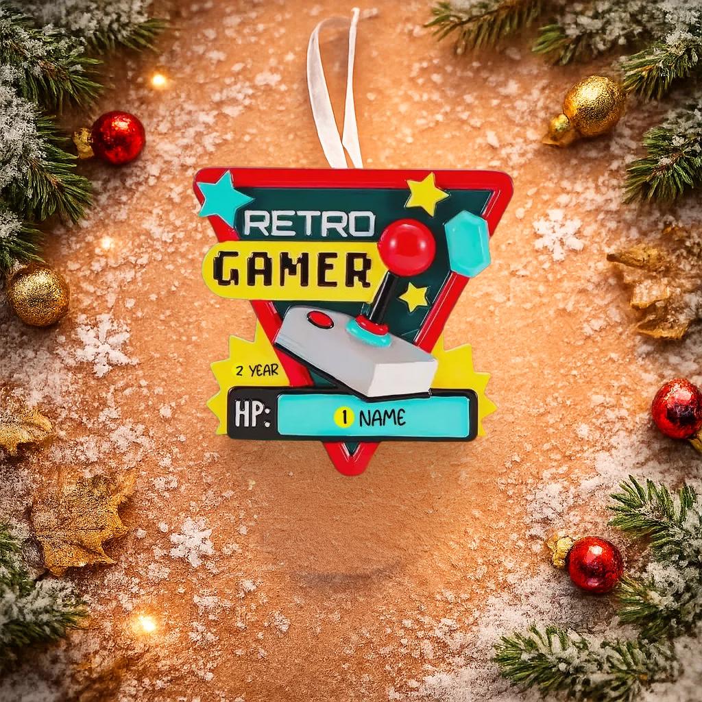 Personalized retro gamer Christmas ornament featuring a classic arcade style joystick and bold gaming icons. Raised 3D front details create depth while the back remains flat for easy hanging. Custom name and year placement make this ornament a fun and nostalgic keepsake for gamers and holiday tree decor.