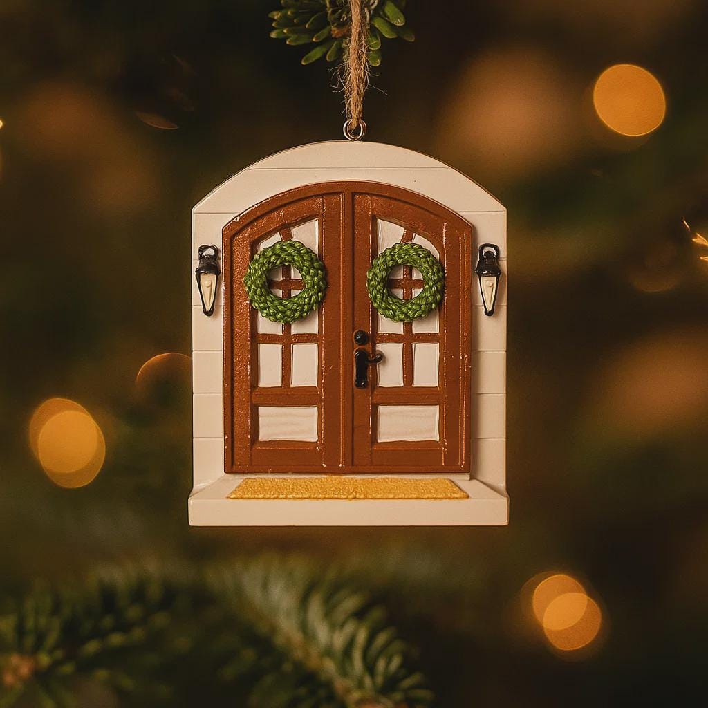 Decorative fairy door ornament with wreaths on a blurred Christmas tree background